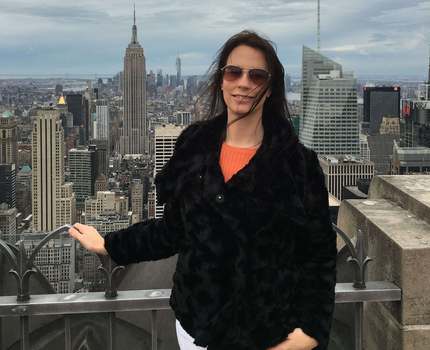 Photo of a woman in front of a skyline in New York City