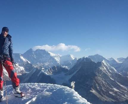 Man standing on top of a mountain