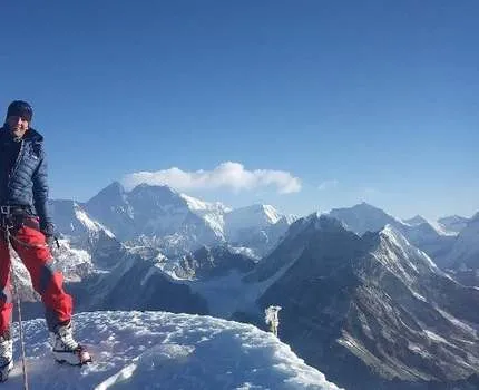 Man standing on top of a mountain